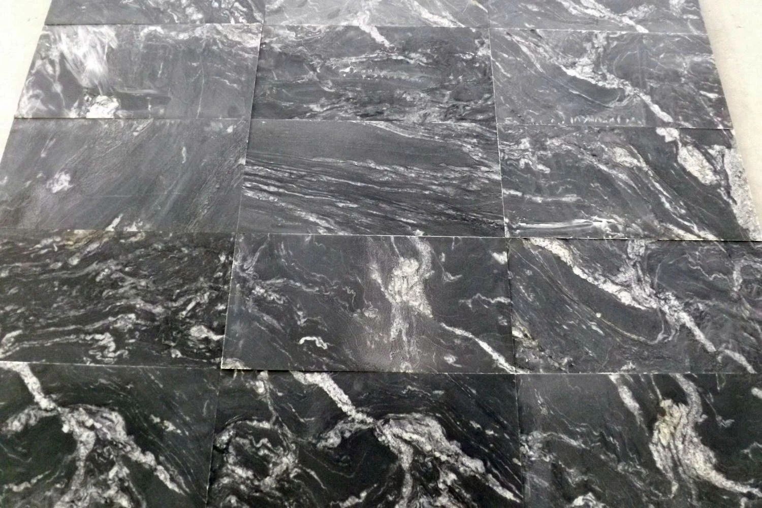 China Black Jet Mist Outdoor Flamed Snow Grey Leather Granite Floor Tiles Slab Price With White Veins